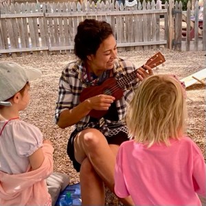 deyani deydreaming — children’s book author playing Ukelele to adorable children